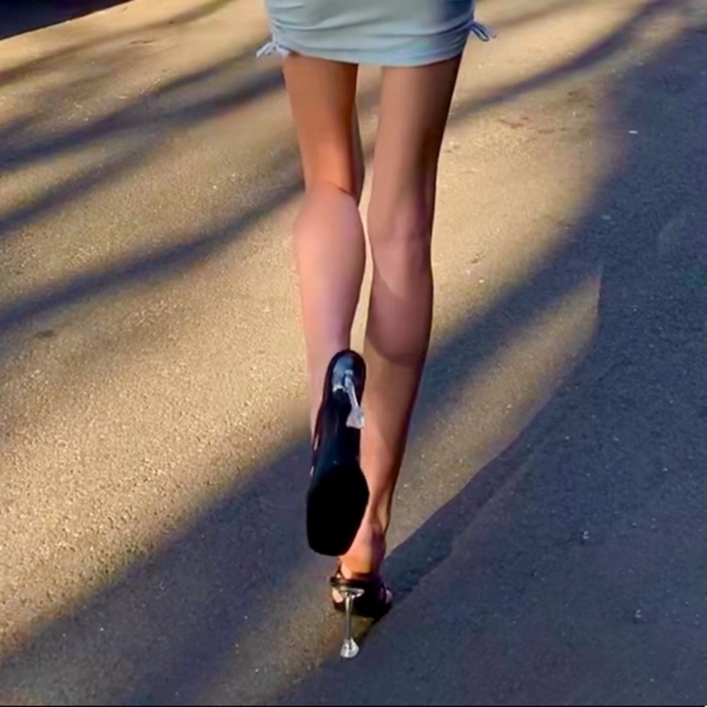 Black strapy design with plastic clear heel